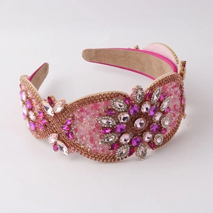 Baroque pink padded headband with luxury crystals and floral rhinestone patterns