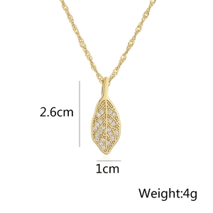 Detail view of 18K gold leaf pendant with cubic zirconia, size 2.6cm by 1cm, weight 4g