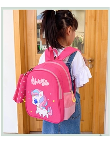 Detail of pink unicorn kids backpack with side mesh pocket and star pendant charm