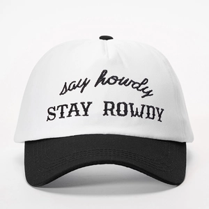 Close-up of Stay Rowdy embroidery on a black and white cotton twill baseball cap