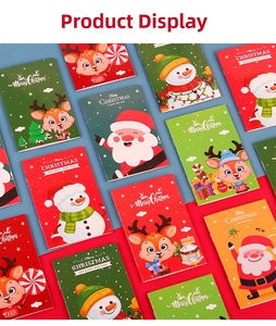 Vista dettagliata di taccuini natalizi con disegni di Babbo Natale e simpatiche renne