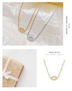 Close-up of gold and silver Evil Eye necklaces with sparkling stones in a gift box