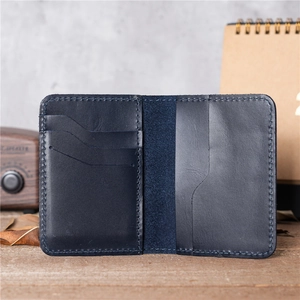 Slim navy blue crazy horse leather card holder with handmade stitching and multi-slots
