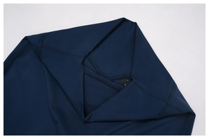Macro shot of V-shaped high waist cross design on dark blue athletic yoga pants