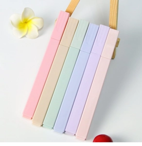 Morandi pastel highlighters set displayed on a small wooden stand for aesthetic stationery