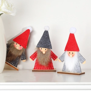 Three Christmas gnomes wooden decorations with felt hats and faux beards for holiday decor
