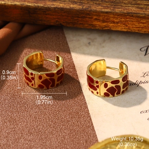 Golden wide hoop earrings with red enamel animal pattern including size measurements