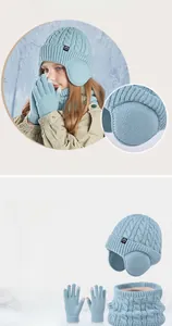 Detailed view of kids' winter knit set featuring thick fleece lining in hat and neck warmer