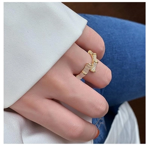 Detailed view of bamboo style ring featuring cat eye stone and micro-pave cubic zirconia