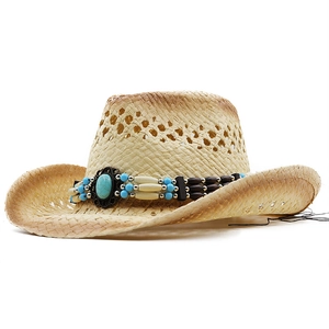 Detail of straw cowboy hat featuring turquoise beadwork and breathable hollow weave