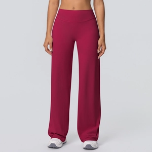 Detailed close-up of wine red high-waisted yoga flare pants with soft brushed texture