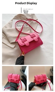 Detail of rose red flap crossbody bag with double buckle decor and matte PU leather texture