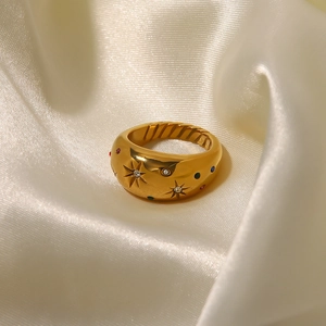 French retro gold star ring with zircon on silk fabric in luxury minimalist style