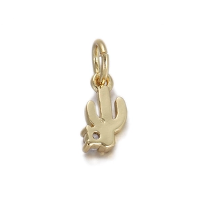 Detailed view of a gold cactus pendant with a small sparkling diamond accent for DIY jewelry