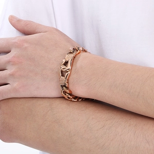 Detail of rose gold titanium chain bracelet for men with vintage link pattern on wrist