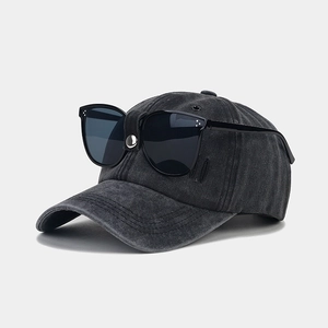 Close-up of vintage pilot baseball cap with integrated sunglasses in washed denim fabric