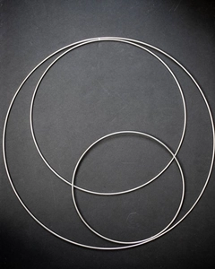 Detailed view of three silver metal rings for DIY Christmas floral wreath decorations