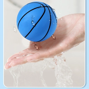 Blue mini rubber basketball for kids being rinsed under clean running water