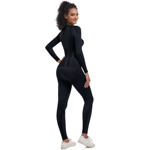 Detail view of seamless black thermal knit ski suit with compression zones and breathable mesh