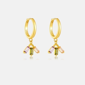 Detailed macro of gold plated S925 silver hoop earrings with colored zircon stones