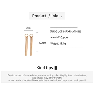 Detail showing 18K rose gold long tassel earrings dimensions of 12.4cm length and 2cm width