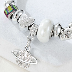 Close-up of silver planet pendant bracelet with Be My Valentine heart bead and crystal