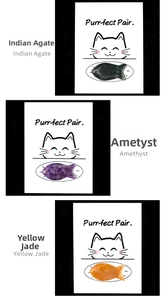 Detail view of fish-shaped natural crystals including Amethyst and Agate on cat-themed cards