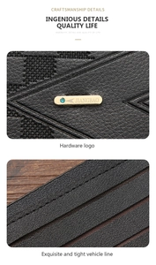 Macro shot of black litchi grain leather wallet with gold metal logo and blue gem stone