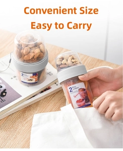 Close-up of portable two-tier food container showing dry-wet separation for nuts and fruit