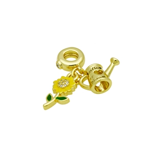 Detail of gold-plated sunflower and watering can charms with colorful enamel finish