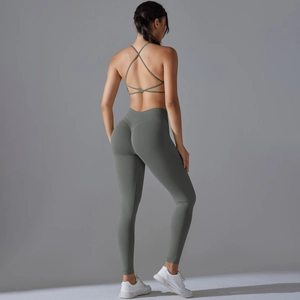 Detail of forest green seamless yoga set featuring cross-back bra and scrunch butt leggings