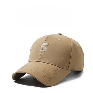Macro detail of high-quality khaki cotton twill baseball cap with 3D letter S embroidery