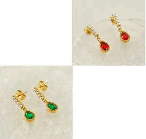 Detail view of gold-plated teardrop zircon earrings with pearls and polishing craftsmanship