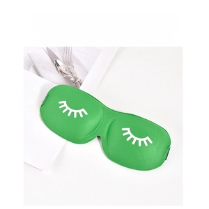 Detail of 3D contoured green sleep mask with eyelash print and adjustable elastic strap