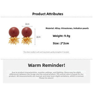 Detailed view of red pearl earrings with gold coral accents and product dimensions
