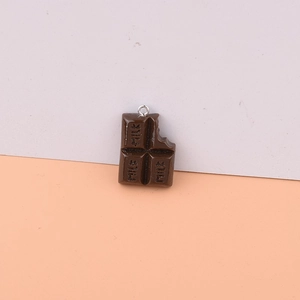 Realistic brown chocolate resin pendant with bite mark detail and silver metal ring