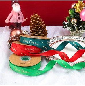 Detail showing red and green Christmas ribbons with gold Merry Christmas lettering