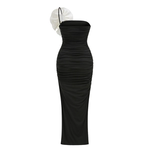 Detail of white 3D floral accent on black strapless dress with ruching textures