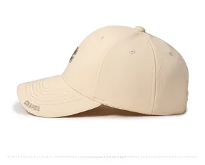 Side view of beige cotton baseball cap with embroidered CHANCE lettering on the brim