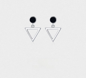 Detailed view of silver S925 geometric earrings with black studs and hollow triangles