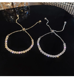 Detail of adjustable square-cut crystal tennis bracelets in gold and silver finish