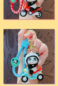Close-up of cute panda rider keychain in red and blue motorbike styles with wrist strap