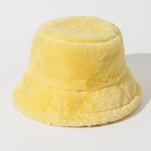 Detailed texture of thick yellow plush faux fur on a warm winter bucket hat