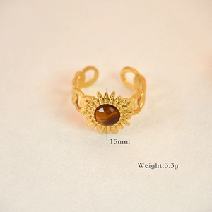 Macro shot of 15mm vintage sunburst ring with tiger eye stone and Cuban link band