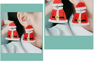 Detailed close-up of Christmas Santa Claus earrings in bright red and white finish