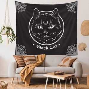 Detail of bohemian black cat wall tapestry with crescent moon in a modern living room