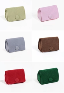 Detailed grid showing six colors of velvet snap-button jewelry pouches for rings