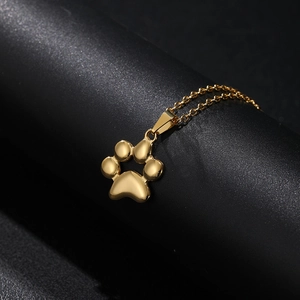 Macro shot of 18K gold plated stainless steel cat paw pendant on O-chain necklace