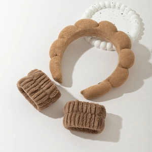 Brown plush cloud headband and wristband set for face washing on white background