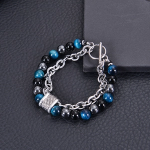 Detail of tiger eye and black obsidian beads with stainless steel OT buckle clasp